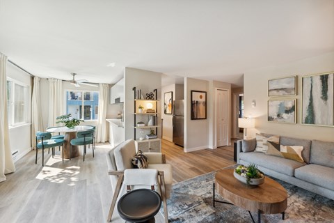 a living room and dining room with a couch and a table